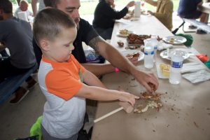 Participants eating crabs